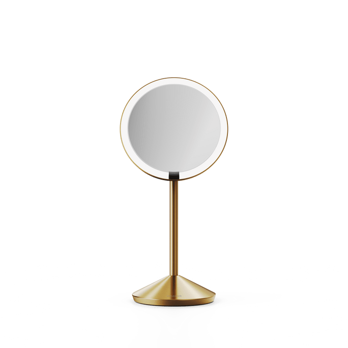 Simplehuman's Sensor Mirror Fold in Brass, front view.