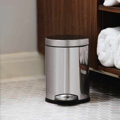 4.5L round pedal bin - polished finish - lifestyle in bathroom by cabinets