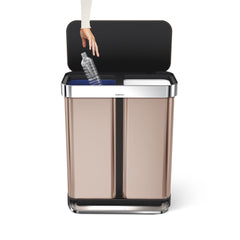 58L dual compartment rectangular pedal bin with liner pocket - rose gold stainless steel - hand dropping bottle in bucket image