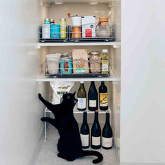 22.8cm pull-out cabinet organiser - lifestyle in cabinet with cat